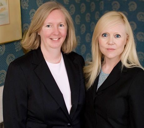 Two women who are part of the team of auto insurance provider Connell & Curley Insurance Agency Inc. in Boston, MA